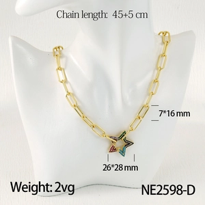 Detail of gold paperclip chain necklace with a colorful star pendant and zircon stones