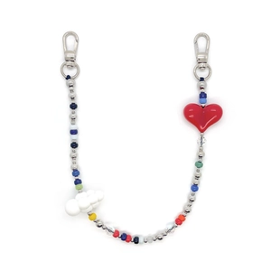 Close-up of colorful beaded phone strap with silver lobster clasps, heart and cloud charms