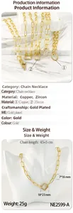Detail of gold paperclip link chain with lightning bolt and zircon pendant necklace
