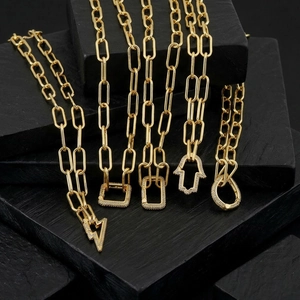 Elegant gold-tone paperclip chain necklaces with sparkling iced-out pendants
