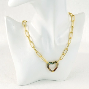 Close-up of golden paperclip chain necklace with a rainbow zircon heart pendant