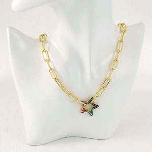 Detailed close-up of gold paperclip chain necklace featuring a colorful star pendant on a bust