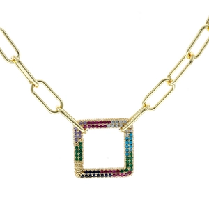 Macro view of gold paperclip chain and hollow square pendant with colorful zircon stones