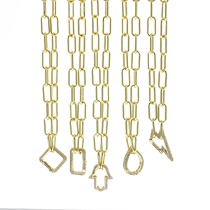 Detail of five gold paperclip chain necklaces with micro-pave zircon pendants and spring clasps