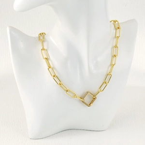 Detailed close-up of a gold paperclip chain necklace with a rhinestone square pendant