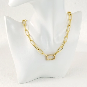 Close-up of gold paperclip chain necklace with a crystal-encrusted rectangular clasp