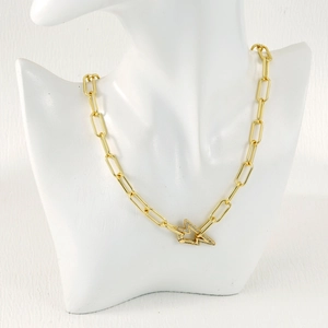 Close-up of gold paperclip link necklace with a micro-pave diamond lightning bolt clasp
