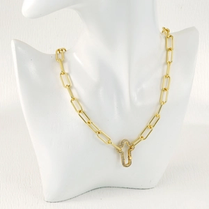 Detail of gold paperclip chain necklace with a sparkling micro-pave zirconia clasp pendant