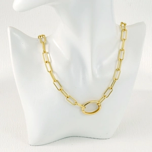 Macro shot of gold paperclip chain link featuring a large decorative oval lobster clasp