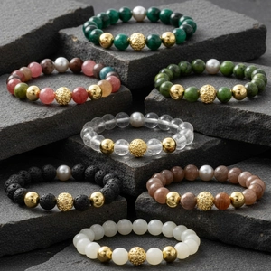 Men semi-precious gemstone beaded bracelet set with natural beads and gold accents.
