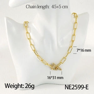 Detail of gold paperclip chain link with star-shaped sparkling cubic zirconia clasp