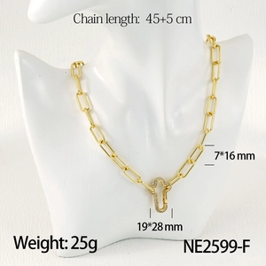 Detail shot of gold paperclip chain necklace with rhinestone cross pendant and size info