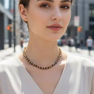 Lapis lazuli and tiger eye square beaded necklace with silver spacers on model