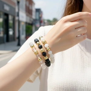 Stackable semi-precious stone and crystal beaded bracelet set for stylish daily wear.