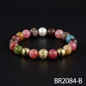 Multi-color gemstone beaded bracelet with gold metal accents for a retro aesthetic.