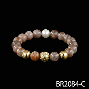 Detailed view of men's semi-gemstone beaded bracelet featuring brown beads and golden accents.