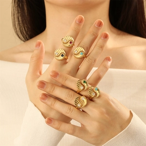 Detailed view of six gold-plated yin yang rings with colorful zircon on model's fingers