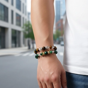 Detailed close-up of beaded crown bracelets with tiger eye stones on a wrist