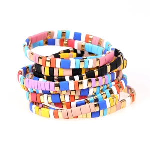 Colorful Tila bead stretch bracelets set with gold accents for bohemian fashion