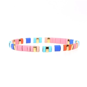Detail shot of colorful Tila beads bracelet with mixed matte finish and golden metallic tiles