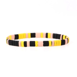 Chic stretch beaded bracelet featuring black, yellow and pink square enamel tiles