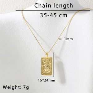 Macro detail of gold Solomon tarot sun necklace with cubic zirconia on model