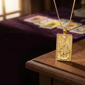 Detail of Nordic Tarot Emperor pendant with crystal inlay on a gold-plated square necklace