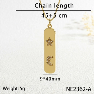 Detailed macro view of gold bar pendant necklace with star moon cubic zirconia and size specs