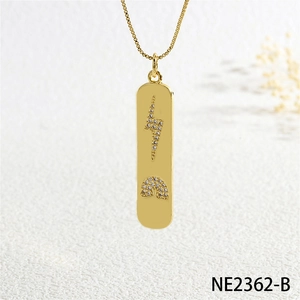 Detail of gold rectangle pendant necklace with crystal lightning and rainbow patterns