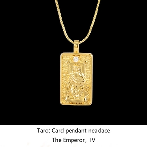Detail of gold Tarot Card pendant showing The Emperor relief with a sparkling white stone