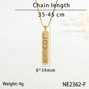 Detailed view of golden LOVER pendant necklace with dimensions 6x34mm and 35-45cm chain