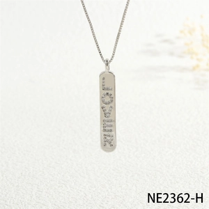 Close-up of silver pendant necklace with LOVER letter design and pavé cubic zirconia