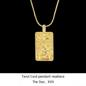 Detailed close-up of golden The Star tarot necklace with a sparkling white zircon stone