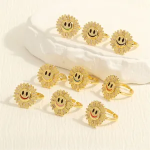 Detail of adjustable sunflower rings set with colorful smiley faces and zircon stones