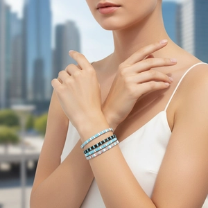 Close-up of colorful Tila bead stretch bracelets set with vibrant enamel square tiles
