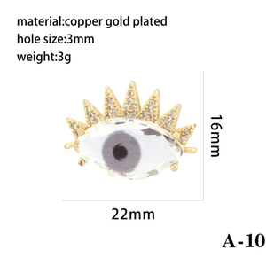 Detailed view of evil eye pendant in gold-plated copper with rhinestone accents and size chart