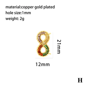 Macro view of gold plated infinity cross pendant with colorful zircon stones inlay
