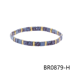 Detail of colorful Tila beaded bracelet with blue-grey tiles and golden metal spacers