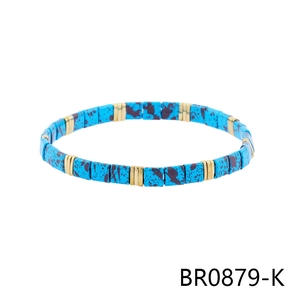 Detail of Bohemian stretch bracelet featuring square turquoise beads and gold spacers