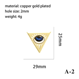 Detail view of gold plated triangle Evil Eye charm with 29x25mm size and 2mm hole