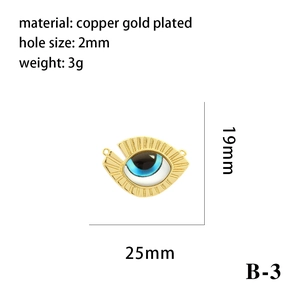 Detail showing 19mm x 25mm dimensions and 2mm hole size of gold-plated evil eye pendant