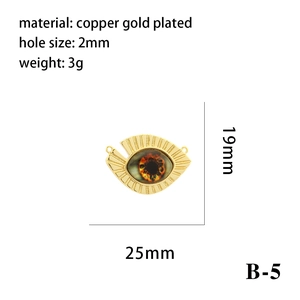 Detail view of gold-plated triangle evil eye charm with dimensions 25x19mm and 2mm hole