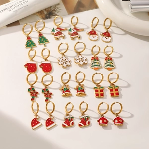 12-pair Christmas earring set with gold stainless steel studs featuring Santa and tree charms