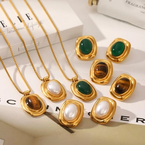 French vintage gold jewelry set with natural stones including necklaces and earrings