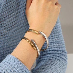 Two-tone mixed metal chunky teardrop bangles in silver and gold finish for women