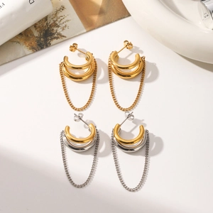 Detail of minimalist gold and silver mixed color tassel chain hoop earrings set