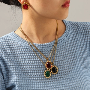 French vintage gold jewelry set with oval gemstone pendant necklace and matching stud earrings
