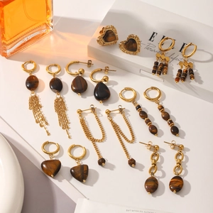 Macro view of vintage tiger eye stone tassel earrings set with gold-plated stainless steel