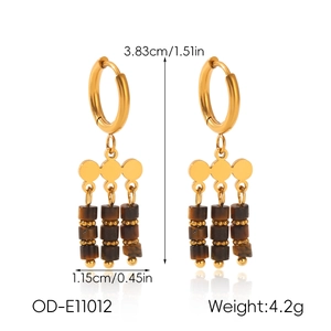 Detail view of retro tiger eye stone tassel earrings with golden stainless steel hoops