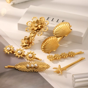 Set de barrettes marguerite en acier doré 18k avec perles et strass brillants